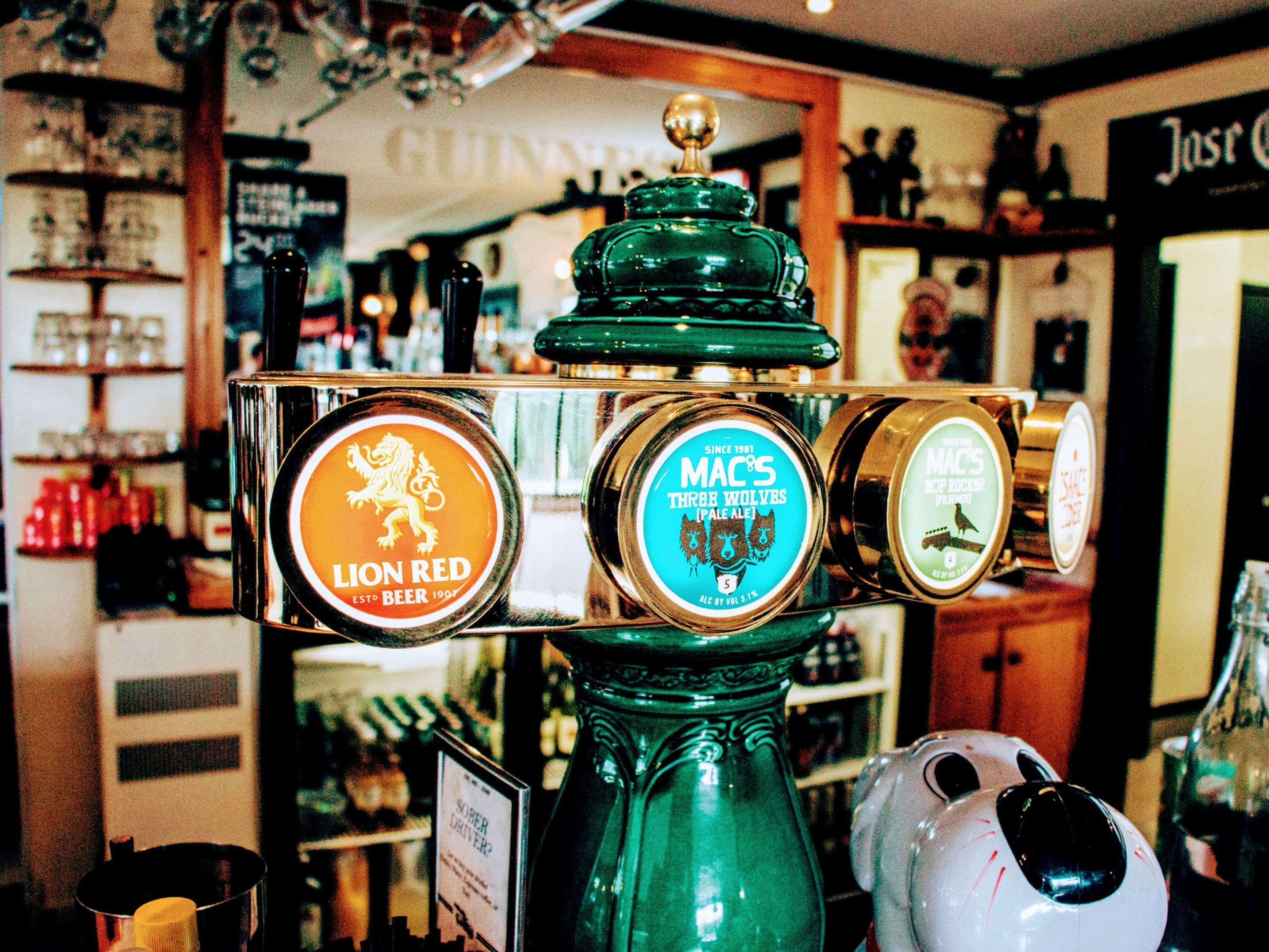 A tap with three beer options: Lion Red, Mac's Three Wolves Pale Ale, and Mac's Rockhouse Pale Ale.