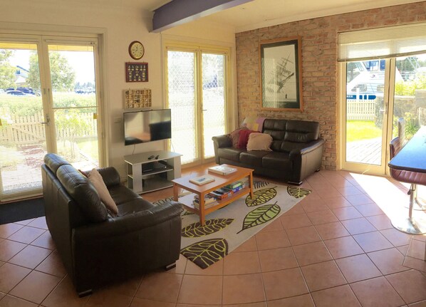 Apartment, 2 Bedrooms, Kitchen, River View | Living area | Flat-screen TV