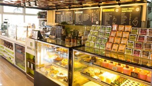 A bakery display with various baked goods and a menu board. - Baguio City Center Hotel (Baguio)