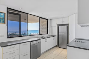 Apartment, 2 Bedrooms, Ocean View (Upper Level, 1 Queen & 2 Singles) | Private kitchen - Burgess @ Kings Beach Apartments (Kings Beach)