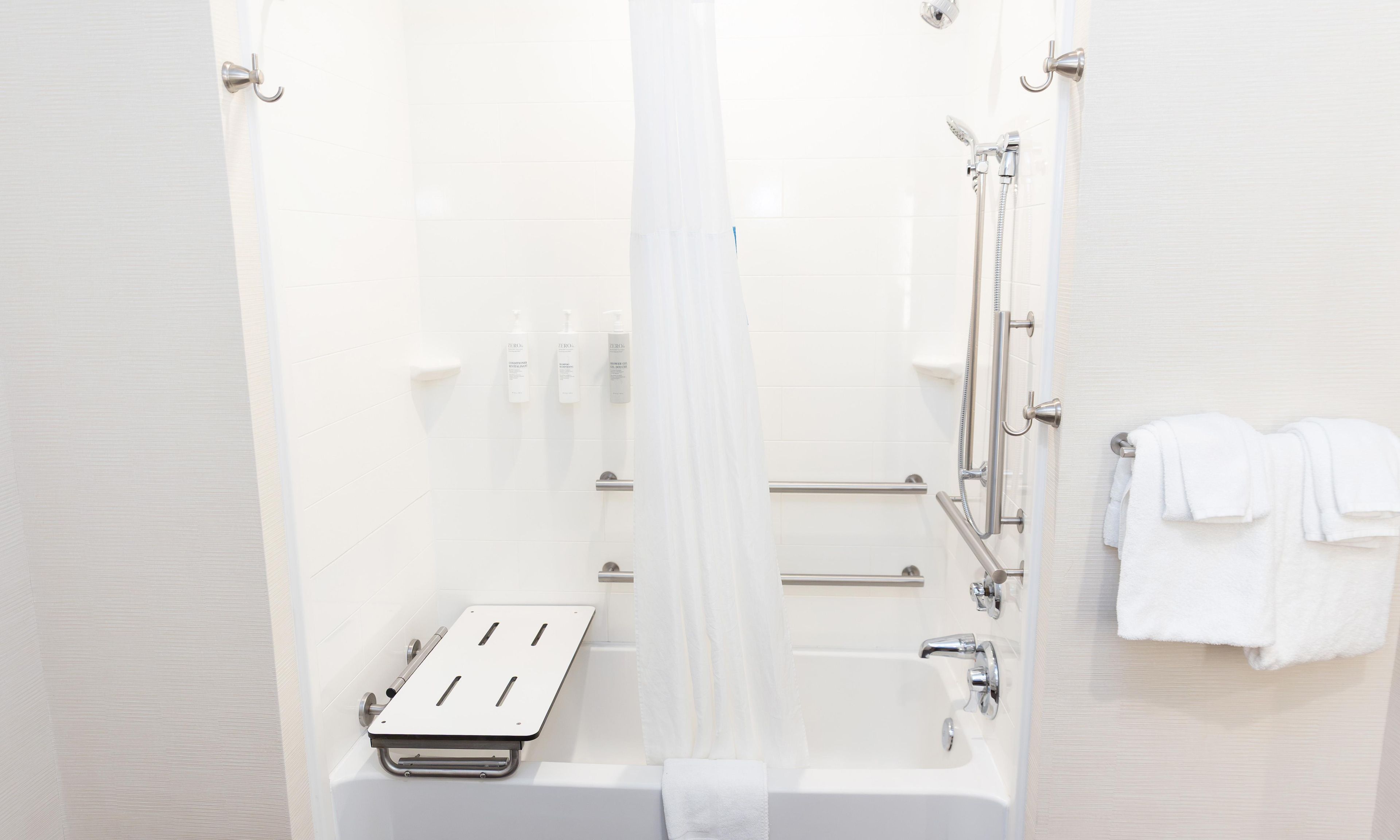 A bathroom with a bathtub, a shower, and a toilet.