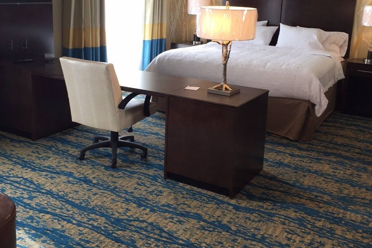 Desk, laptop workspace, blackout drapes, iron/ironing board
