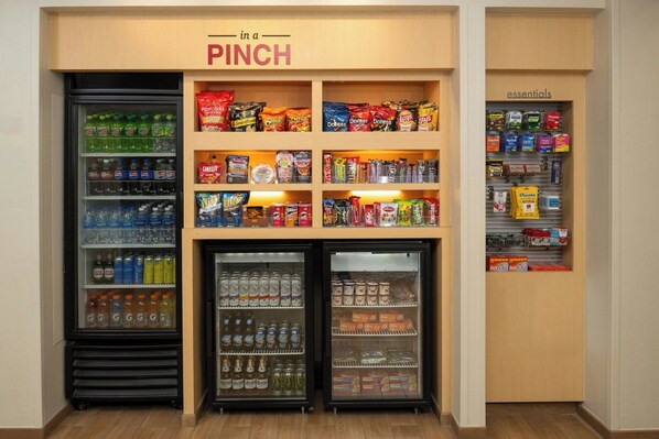 A vending machine area with various snacks and drinks, including Pepsi, Aquafina water, and Gatorade.
