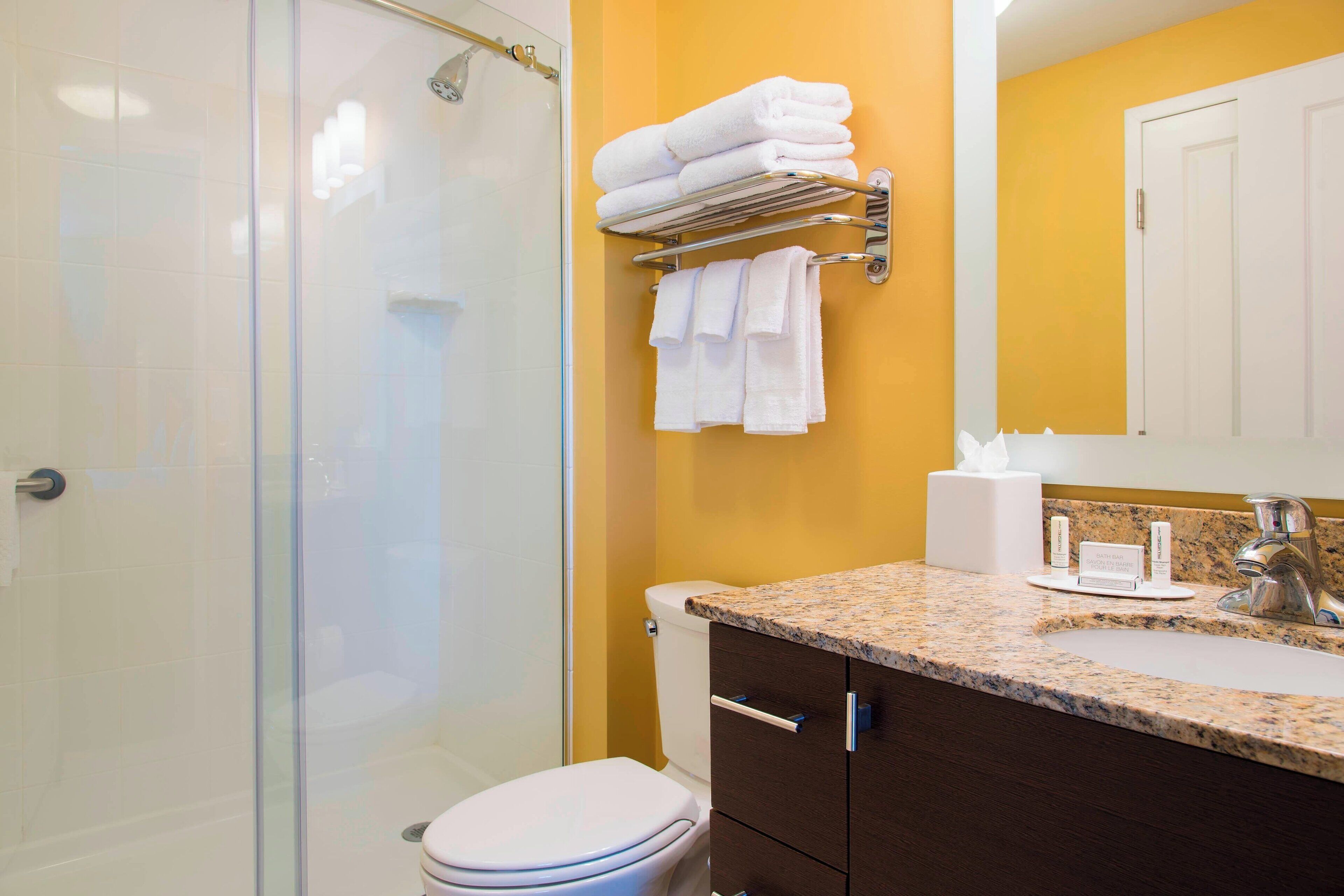 shower, designer toiletries, hair dryer, towels