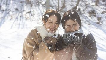 Two people in a snowy outdoor setting.