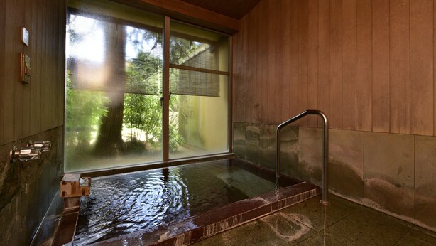 A wooden interior with a large window, a hot tub, and a metal handrail. - Sanyo-so (Izunokuni)