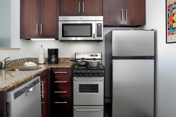 Full-sized fridge, microwave, stovetop, dishwasher