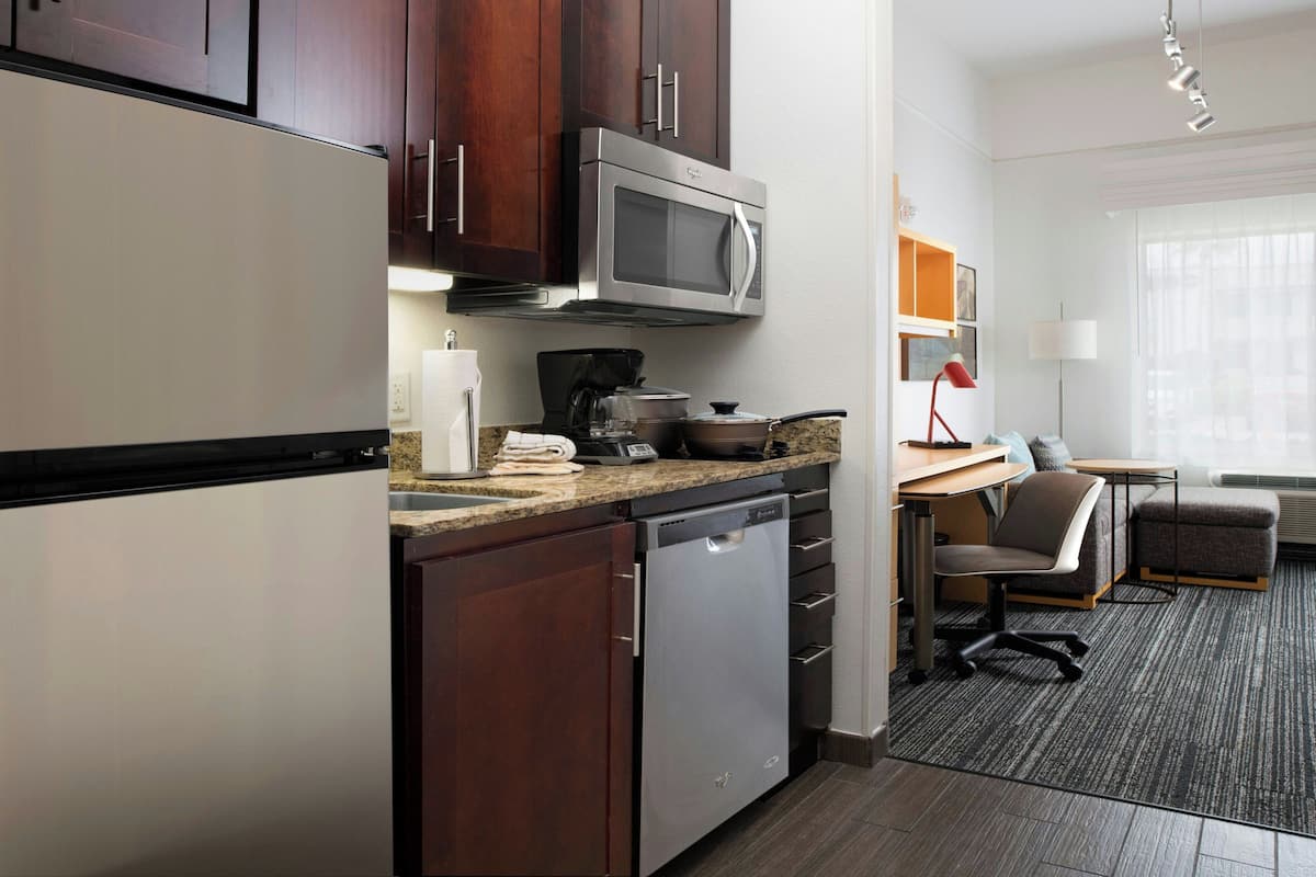 full-sized fridge, microwave, stovetop, dishwasher
