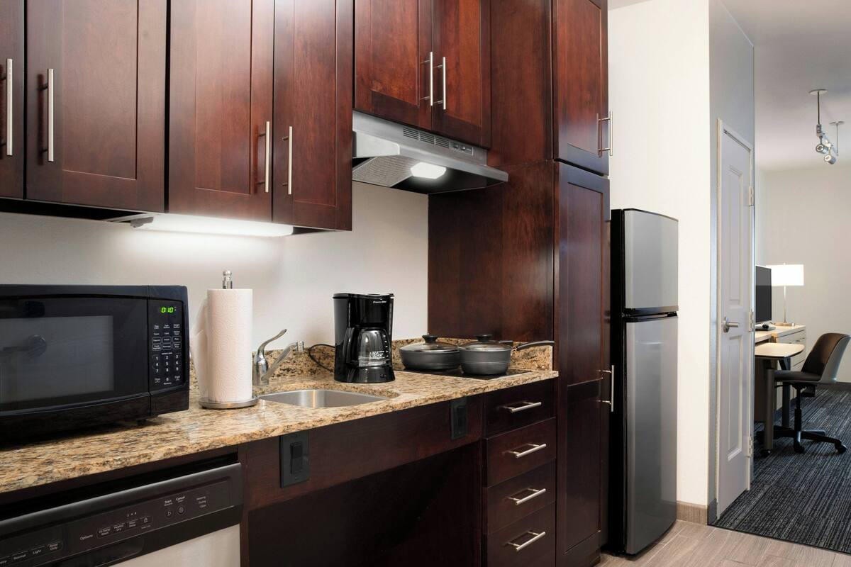 full-sized fridge, microwave, stovetop, dishwasher