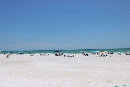 Beach nearby, white sand, beach towels