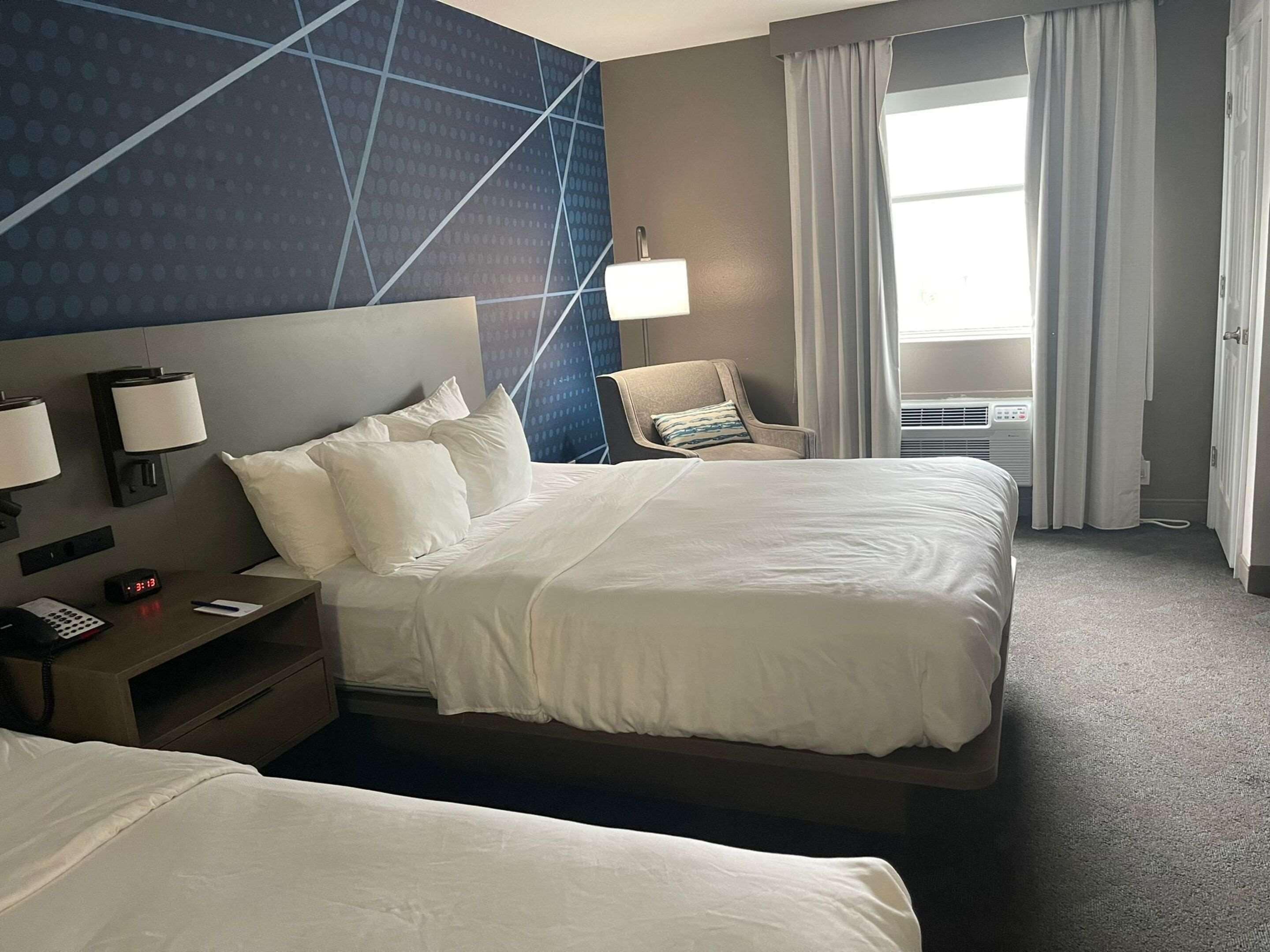 Desk, laptop workspace, blackout drapes, iron/ironing board