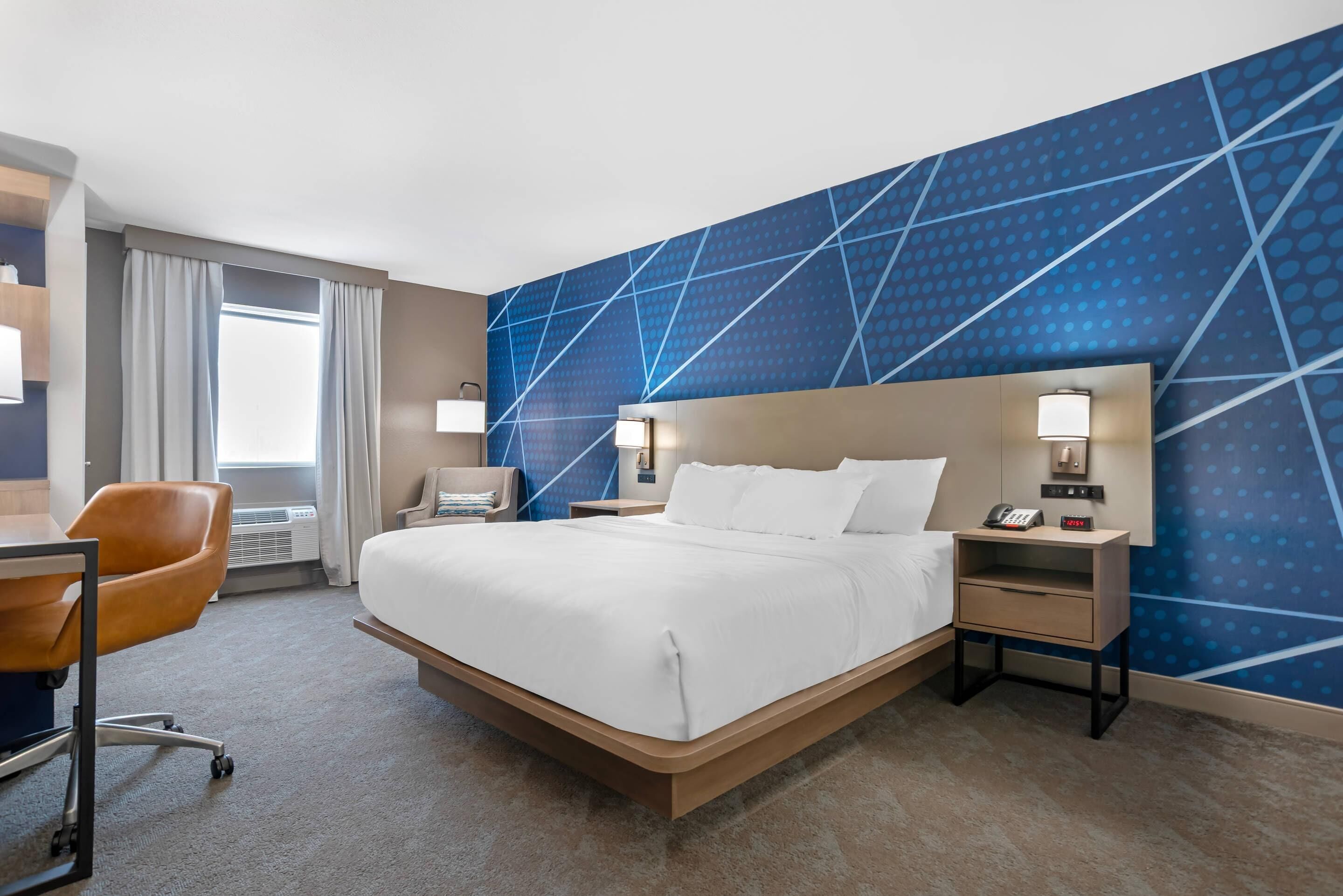 Desk, laptop workspace, blackout drapes, iron/ironing board