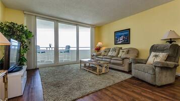 Premier Condo, 1 Bedroom | Living area | Flat-screen TV