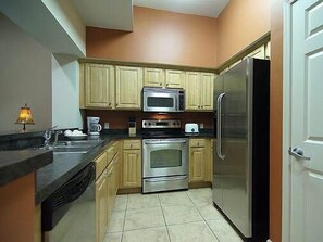 Standard Condo, 3 Bedrooms | Private kitchen | Full-size fridge, microwave, coffee/tea maker, cookware/dishes/utensils