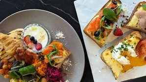 A breakfast setting with toast, eggs, and a variety of fruits and vegetables. - Tokyu Stay Shinjuku (Tokyo)