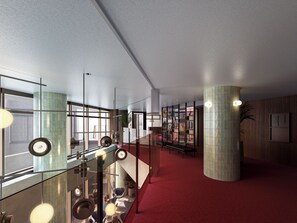 A modern interior with a glass railing, red carpet, and a staircase. - Tokyu Stay Shinjuku (Tokyo)