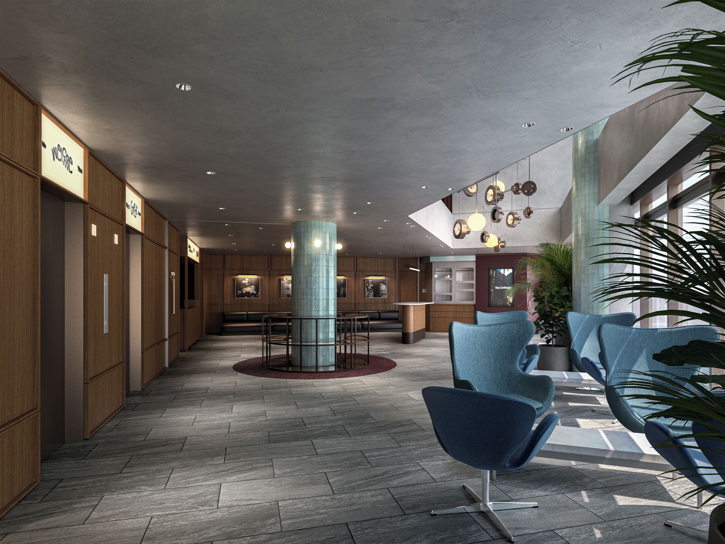 A modern lobby with a central column, seating area, and a reception desk.