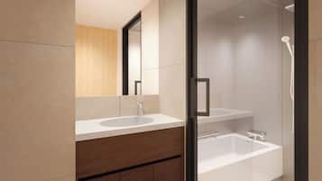 A modern bathroom with a glass-enclosed shower, a wooden vanity, and a large mirror.