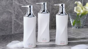 Three white bottles with silver tops labeled "ReFa" on a tiled surface. - Tokyu Stay Shinjuku (Tokyo)