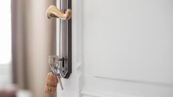 A door handle and a keychain with a cork key.