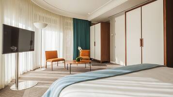 Premium bedding, down comforters, minibar, in-room safe