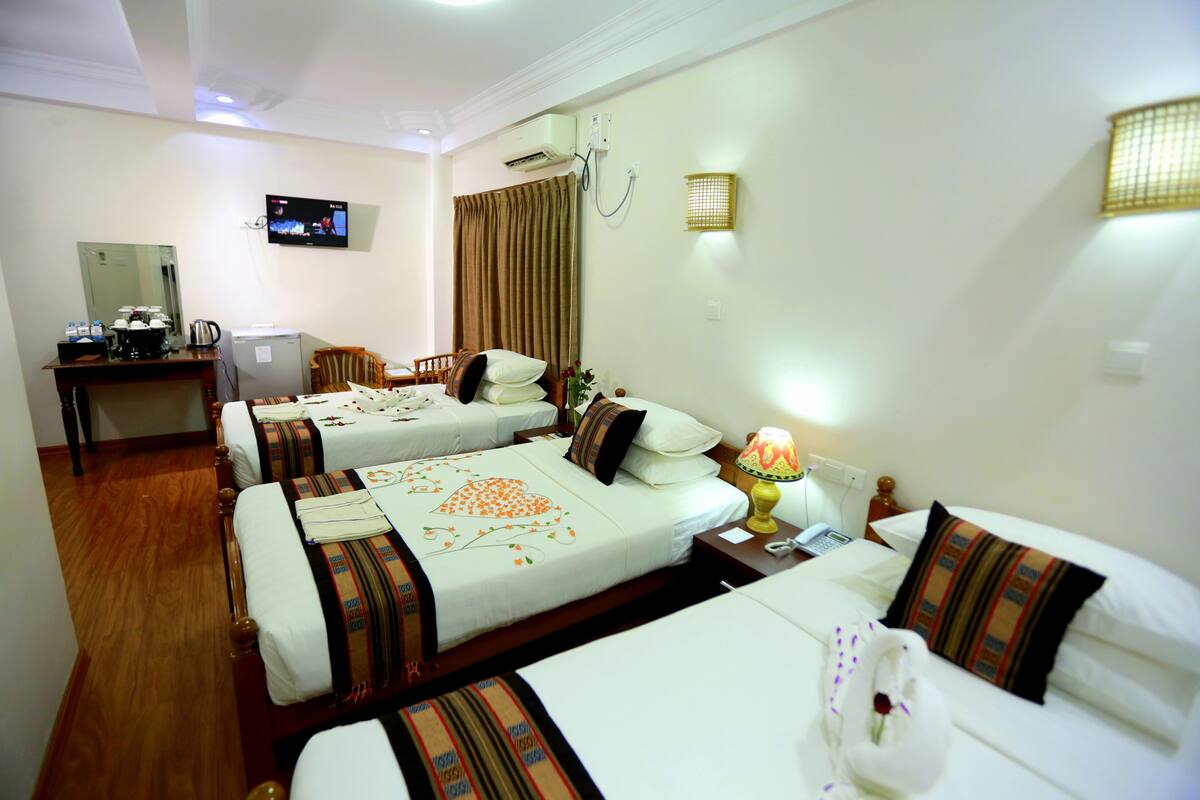 Grand Triple Room, 3 Bedrooms, Garden View | Minibar, in-room safe, desk, blackout drapes