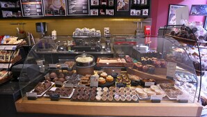 A bakery display case with various baked goods and pastries. - London Kings Hotel (London)