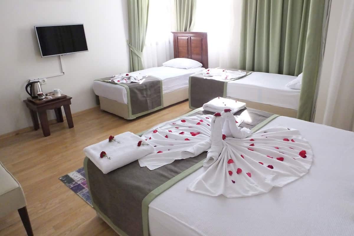 Deluxe Quadruple Room, 1 Bedroom, City View | Egyptian cotton sheets, minibar, in-room safe, desk