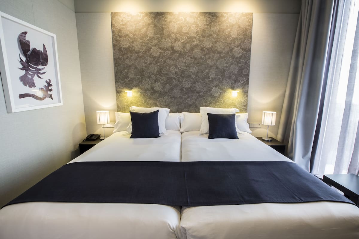 premium bedding, down duvets, minibar, in-room safe