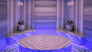Experience the circular room's symmetrical design, featuring wall-mounted fixtures and a reflective surface that mirrors the ceiling and walls.