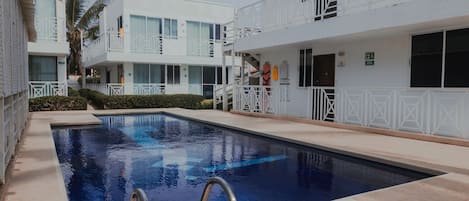 Outdoor pool, open 8:00 AM to 7:00 PM, sun loungers
