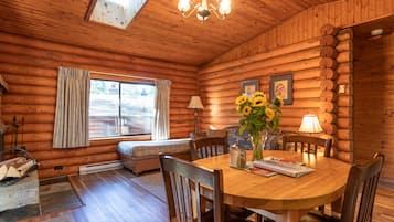 One Bedroom Cabin, King Bed | Living area | 32-inch flat-screen TV with cable channels, TV, streaming services