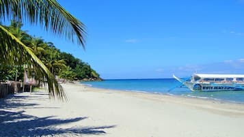 On the beach, sun loungers, beach towels, scuba diving