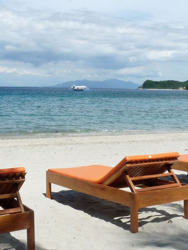 On the beach, sun-loungers, beach towels, scuba diving