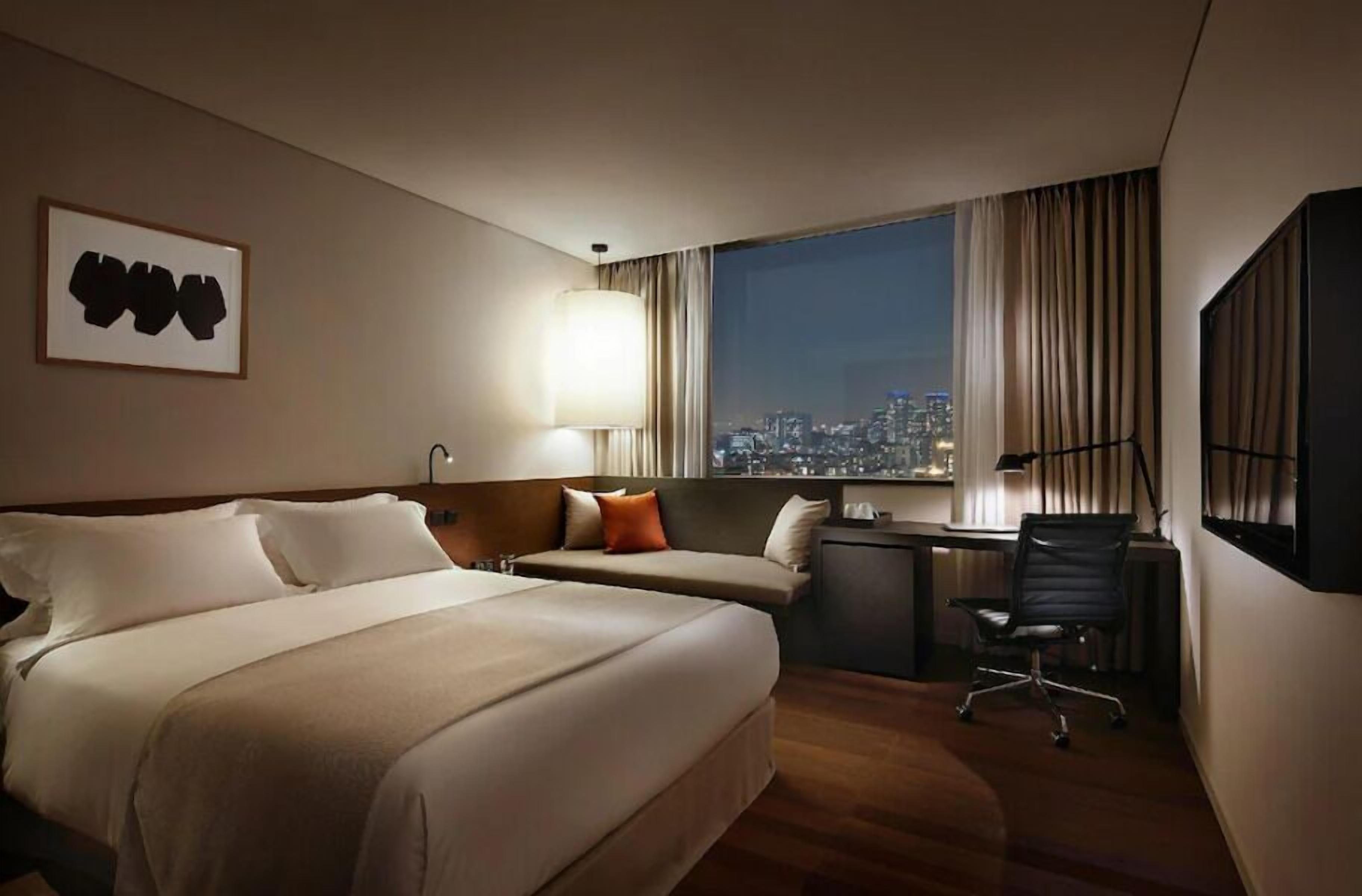 Premium bedding, down duvets, pillow-top beds, in-room safe