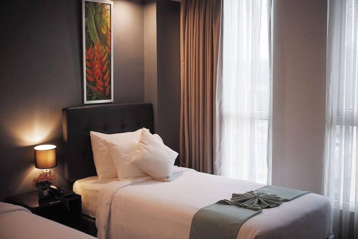 Premium bedding, pillow-top beds, blackout curtains, free WiFi