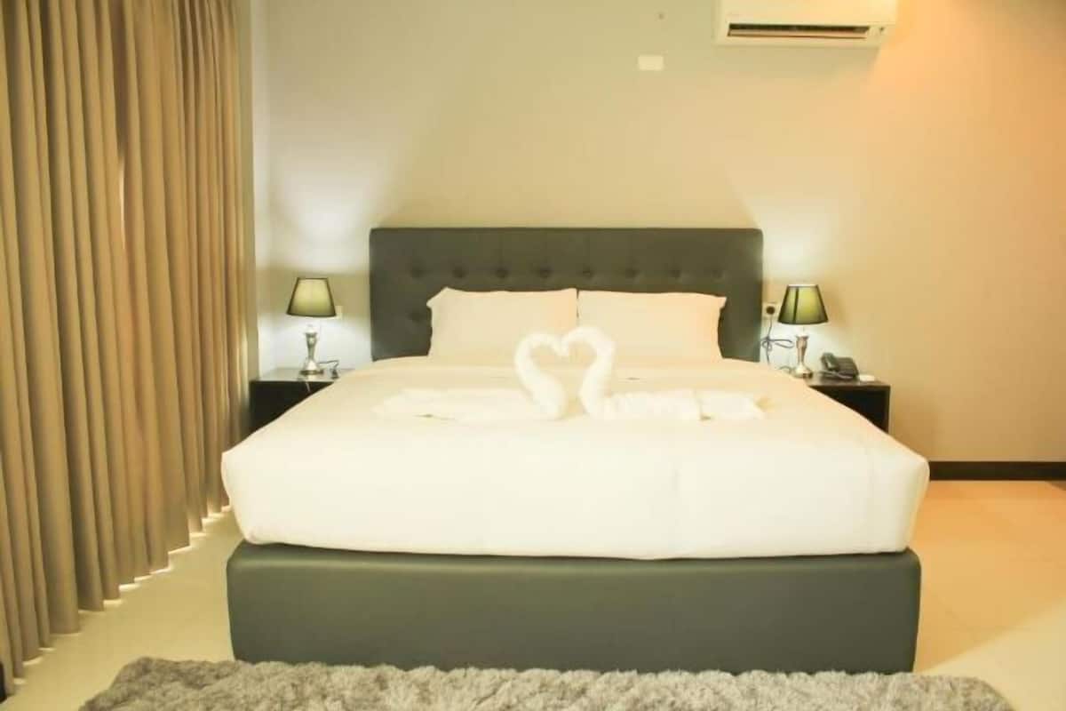 Premium bedding, pillow-top beds, blackout curtains, free WiFi