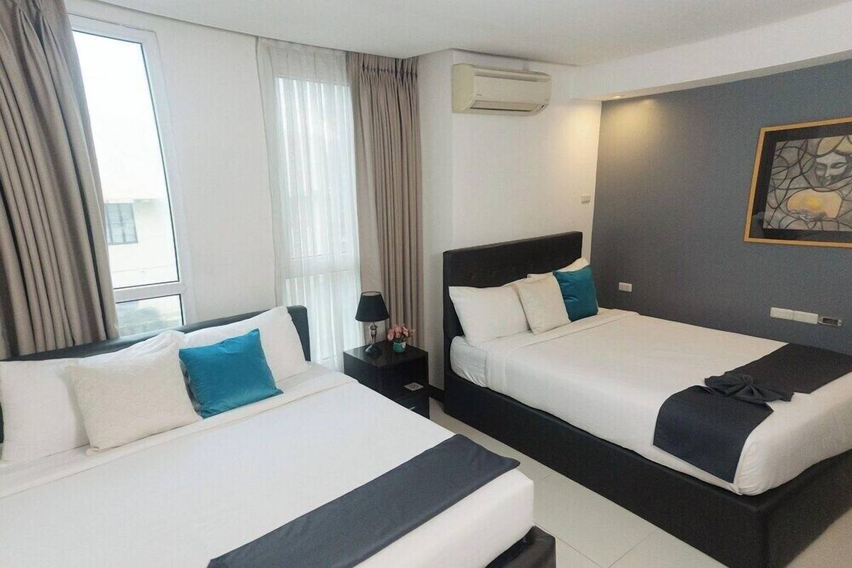 Premium bedding, pillow-top beds, blackout curtains, free WiFi