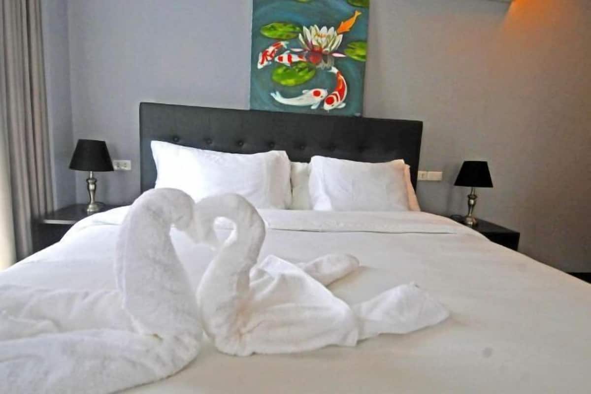 Premium bedding, pillow-top beds, blackout curtains, free WiFi