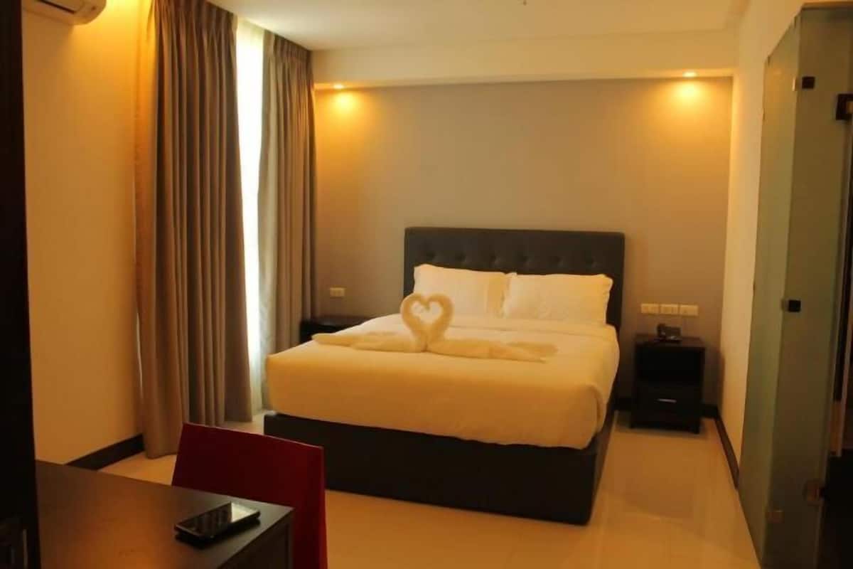 Premium bedding, pillow-top beds, blackout curtains, free WiFi
