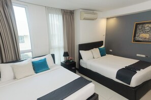 Family Room - Two Queen Beds, Ideal for Groups | City view - The Upperhouse Hotel – Boutique Stay with City & River Views (Cagayan de Oro)