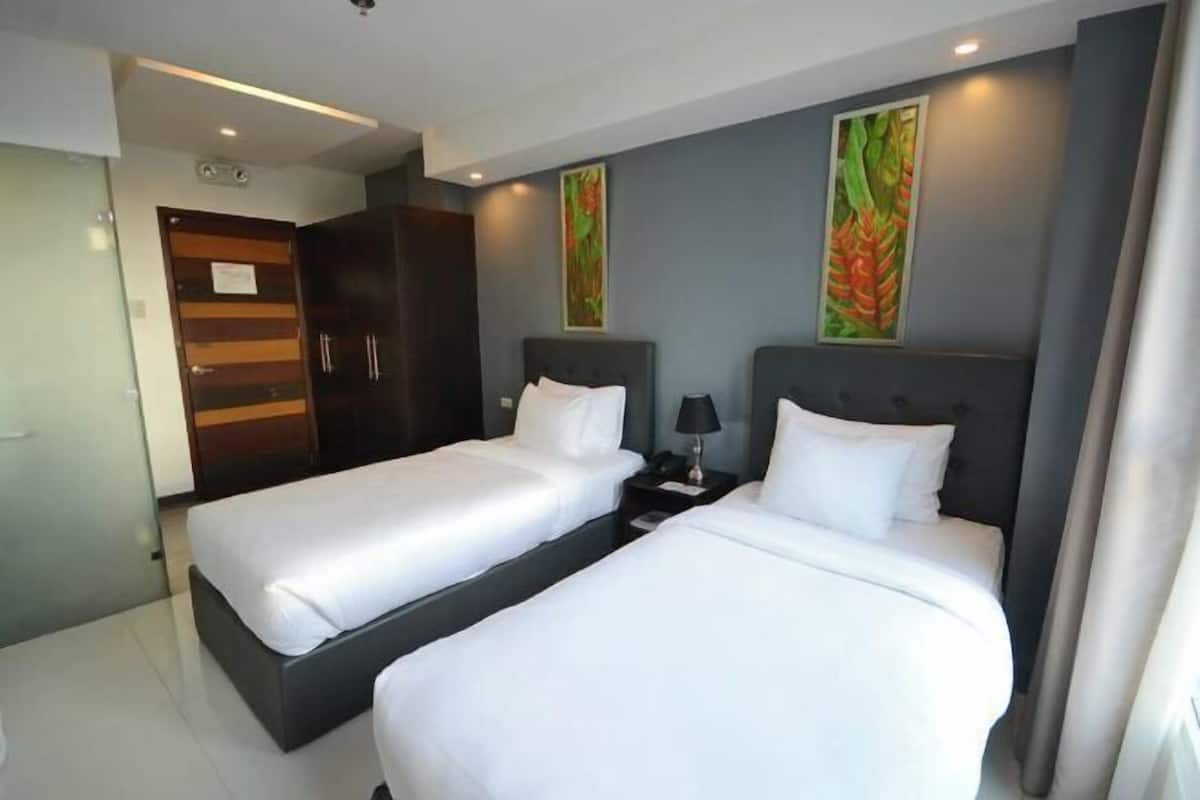 Premium bedding, pillow-top beds, blackout curtains, free WiFi