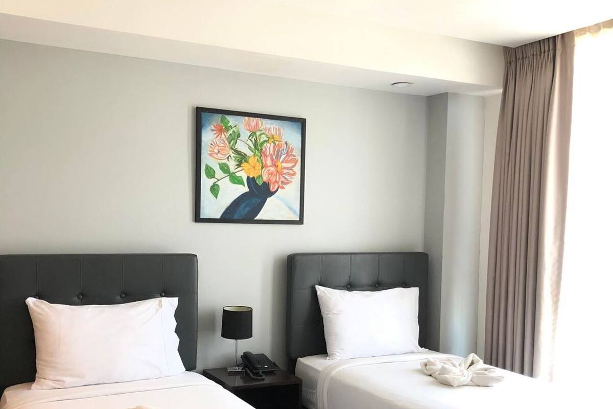 Premium bedding, pillow-top beds, blackout curtains, free WiFi