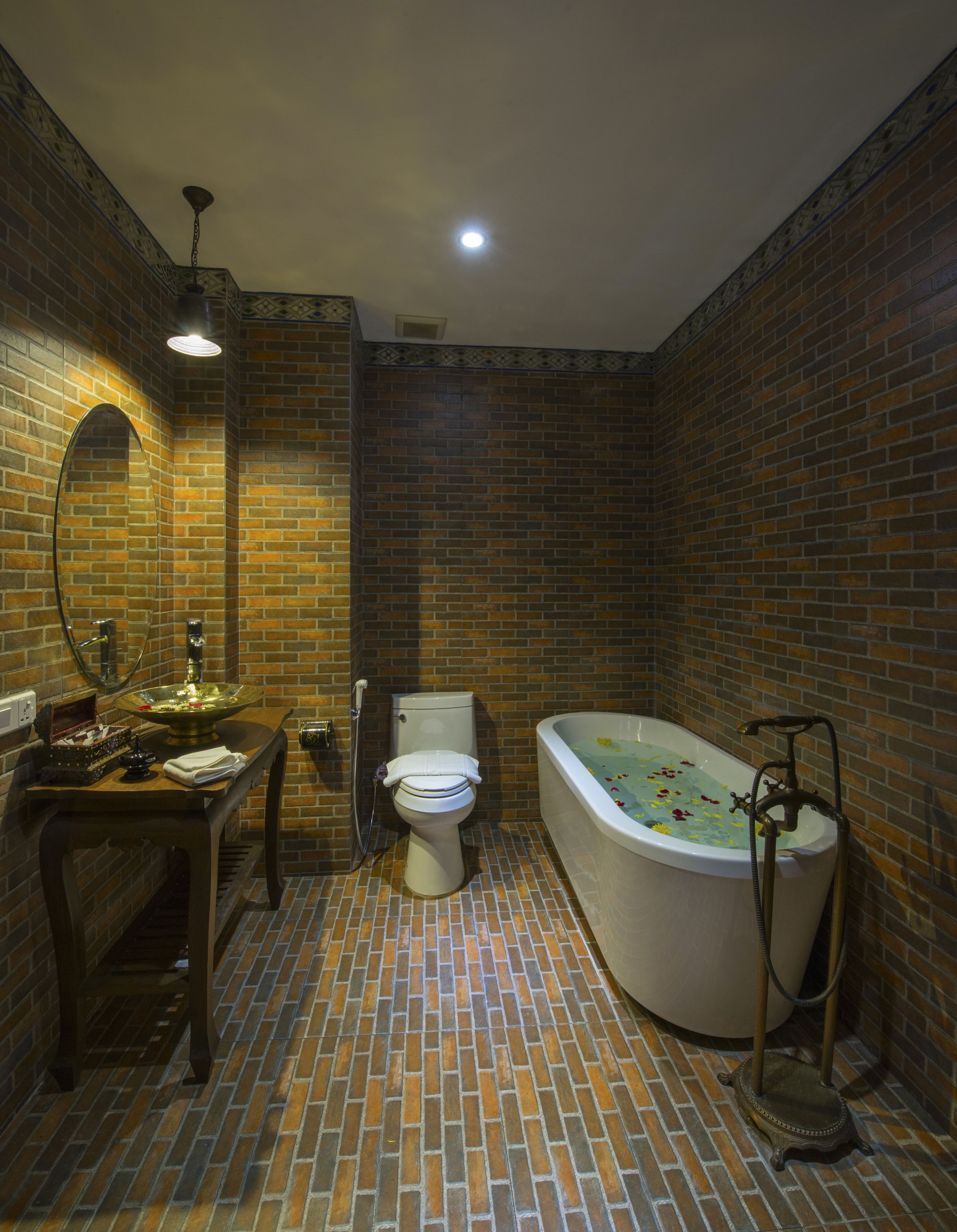deluxe room | bathroom | deep-soaking bathtub, rainfall showerhead, free toiletries, hair dryer