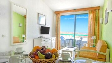 Apartment, 1 Bedroom, Balcony, Partial Sea View | Living area | TV