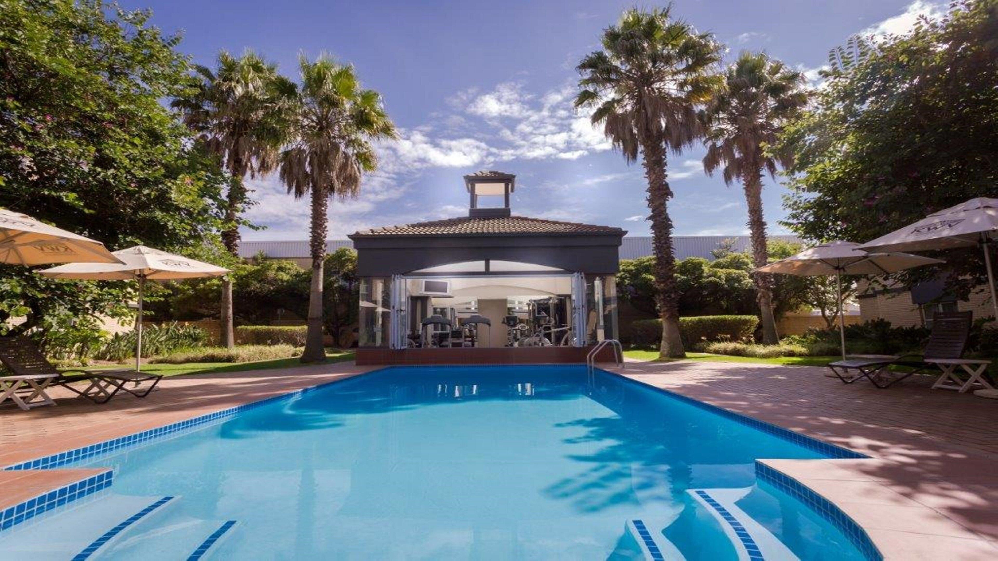 Outdoor pool, open 7:00 AM to 6:00 PM, pool loungers