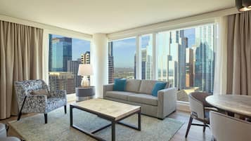 Suite, 1 Bedroom, Corner | Living area | 49-inch flat-screen TV with cable channels, TV, iPod dock
