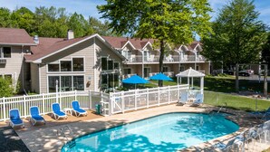A pool area with lounge chairs, a gazebo, and a fenced deck. - Somerset Inn & Suites (Ephraim)