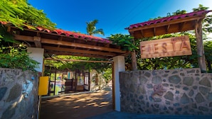 A wooden sign with "HOTEL FIES GALAPAGOS" indicating the name of the establishment. - Hotel Fiesta (Puerto Ayora)