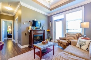 The "Under the Tuscan Sun" Suite | Living area | Flat-screen TV, fireplace